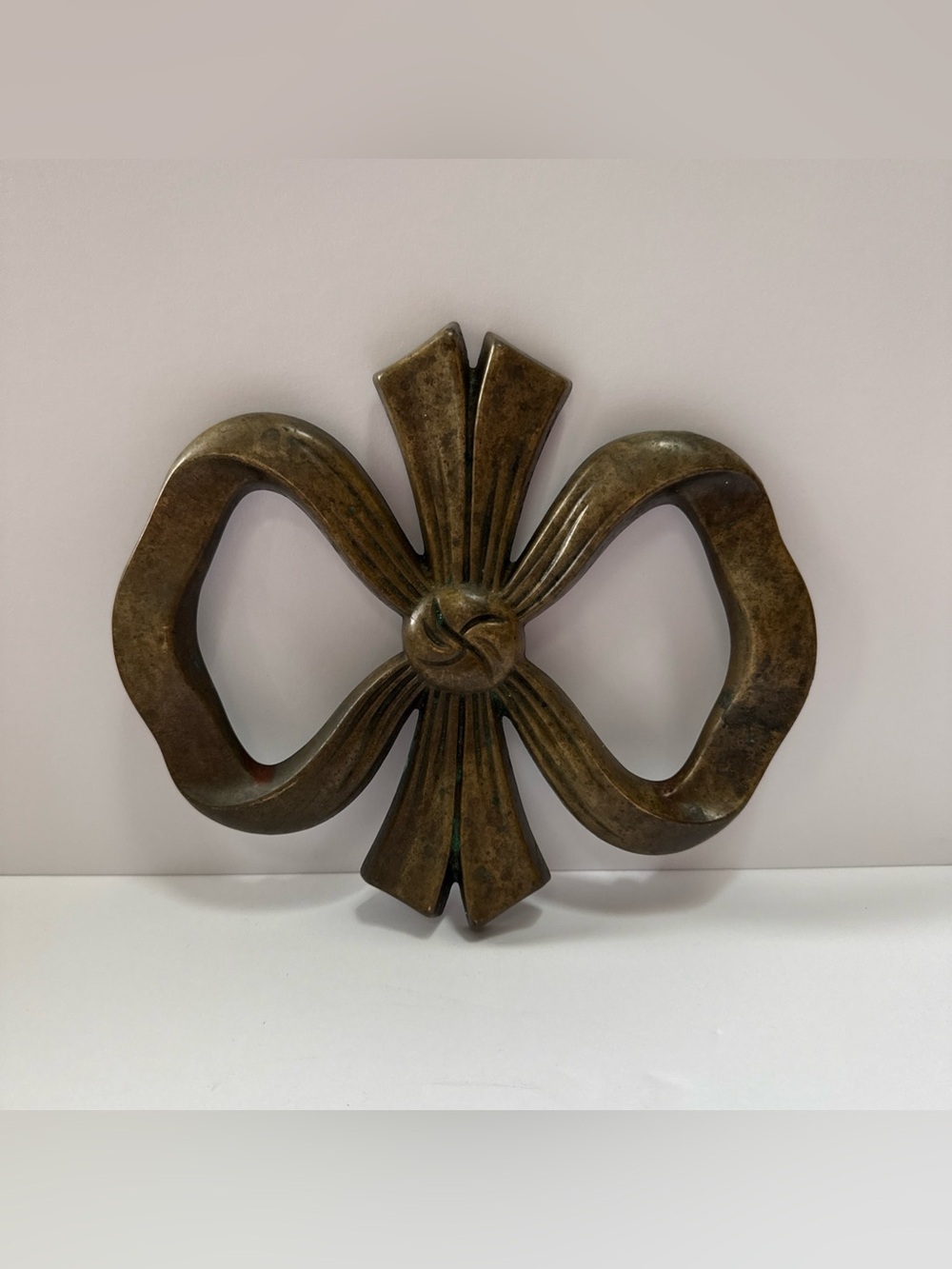Brass Trivet or wall decor. Rubber feet. VTG